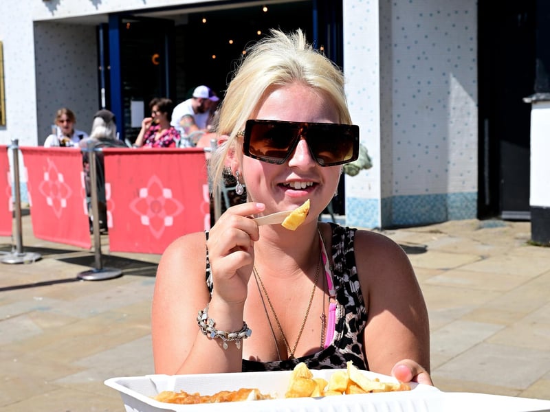 Enjoying fish and chips on the seafront.