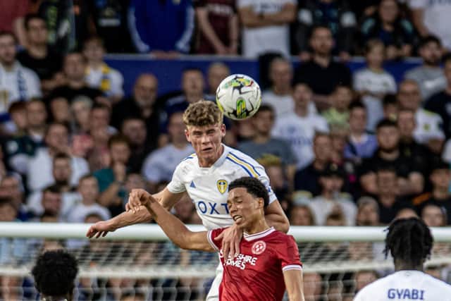 Leeds United defender Charlie Cresswell gets up above his opponent to win an aerial duel (Pic: Tony Johnson)