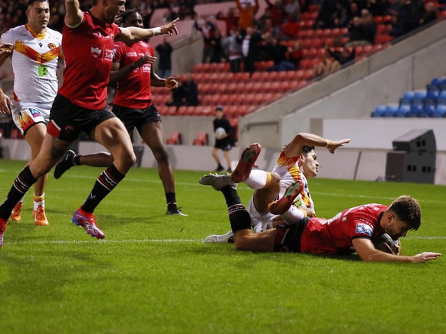 Grade A late contact on passer, one penalty point, total points one - no further action.