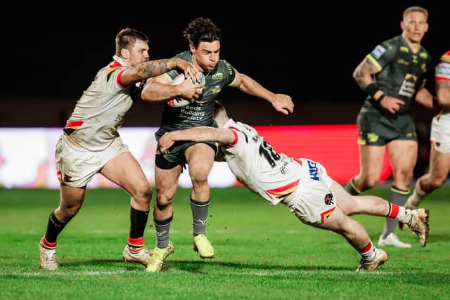 Bradford Bulls' Ryan Sutton and Loghan Lewis tackle Brodie Croft, of Leeds Rhinos, during the Good Friday derby at Odsal. Picture by Alex Whitehead/SWpix.com.