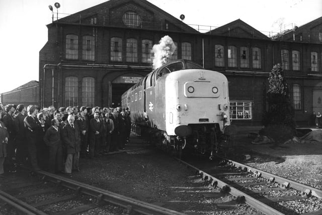 The Class 55 Deltic leaves the workshed at Crimpsall in November 1981 with British Rail employees looking on.