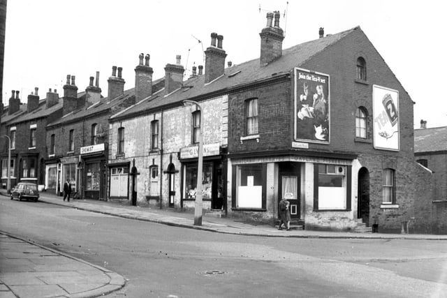 Oatland Lane at the junction with Oatland Road. A drapers shop business of G Lyons is number 108. At the corner is number 106, a fish and chip shop. Pictured in August 1967.