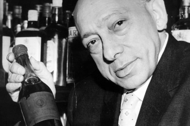 Harry Joseph, managing director of England's oldest music hall, the City Varieties, pictured in November 1960 with a rare Napoleon brandy of 1811 vintage. One of the main attractions of the theatre's bar for the last 15 years, it has always been highly prized by Mr Joseph for sentimental reasons, and kept as a showpiece.