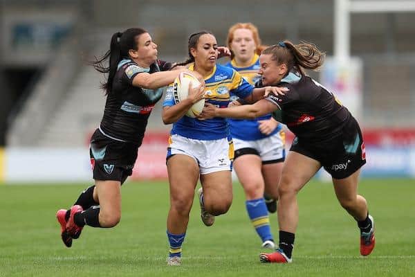 Jasmine Earnshaw-Cudjoe on the attack for Rhinos against St Helens in the Nines tournament at Salford. Picture by John Clifton/SWpix.com.