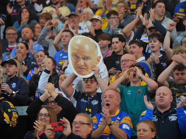 Rhinos coach Brad Arthur makes an 'appearance' among the fans at the game against Wigan.