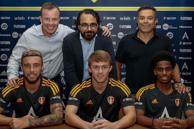 NEW DEALS - Leeds United CEO Angus Kinnear, director of football Victor Orta and majority owner Andrea Radrizzani with Sam Greenwood, Joe Gelhardt and Crysencio Summerville.