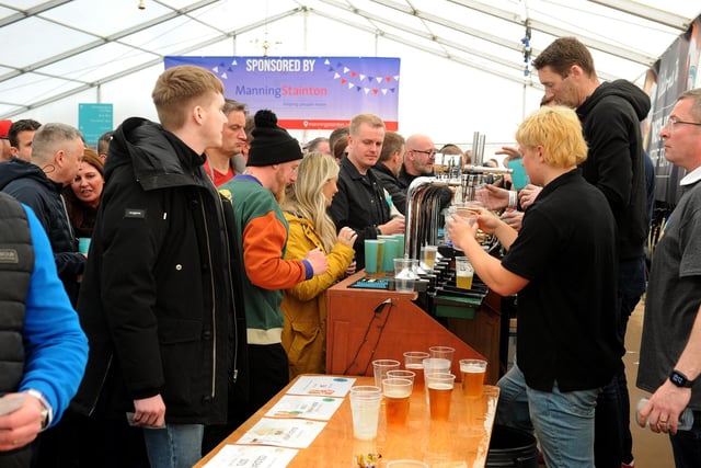 Festival staff hard at work pouring pints.