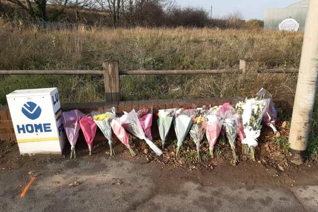 Nearly 20 bouquets of flowers have been left on the side of Elland Road