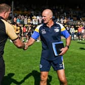 Leeds Rhinos coach Brad Arthur, right, shakes hands with rival Ryan Carr after their sides' meeting last Sunday. Picture by Matthew Merrick/SWpix.com.