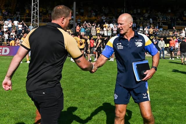 Leeds Rhinos coach Brad Arthur, right, shakes hands with rival Ryan Carr after their sides' meeting last Sunday. Picture by Matthew Merrick/SWpix.com.