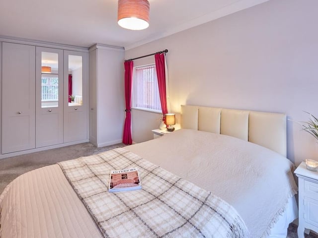This home boasts five double bedrooms, one of which is located downstairs and has a shower room.