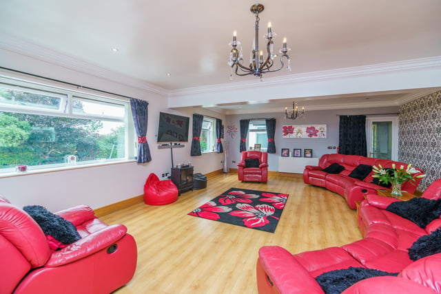 Internally, the property features three main reception rooms, including a huge living room.