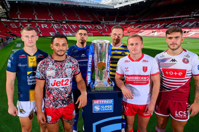 Leeds Rhinos captain and stand-in full-back Ash Handley, left, with players from the other five Super League play-off teams at Old Trafford. Left-right: Umyla Hanley (Leigh), Caleb Hamlin-Uele (Wakefield), Ben Currie (Warrington), Jez Litten (hull KR) and Brad O'Neill (Wigan). Picture by Allan McKenzie/SWpix.com.