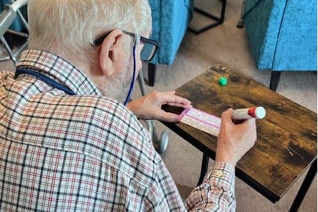 Hambleton Grange resident Johnny Coverdale scoring on his bingo card