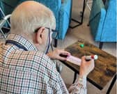Hambleton Grange resident Johnny Coverdale scoring on his bingo card