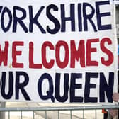 This banner held by Philip Baxter (left) and Colin Holt from the Yorkshire Ridings Society greeted The Queen as she arrived at Leeds City Station.