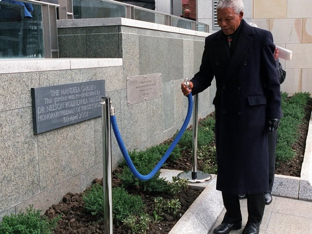 Nelson Mandela  re-dedicates Mandela Gardens in Millennium Square during his visit to the city in April 2001.