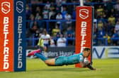 Richie Myler scores for Rhinos in their win at one of his former clubs, Warrington Wolves, in June, 2023. Picture by Ed Sykes/SWpix.com.