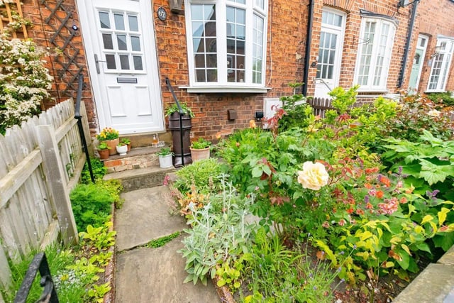 The welcoming cottage-style garden to the front of the property.