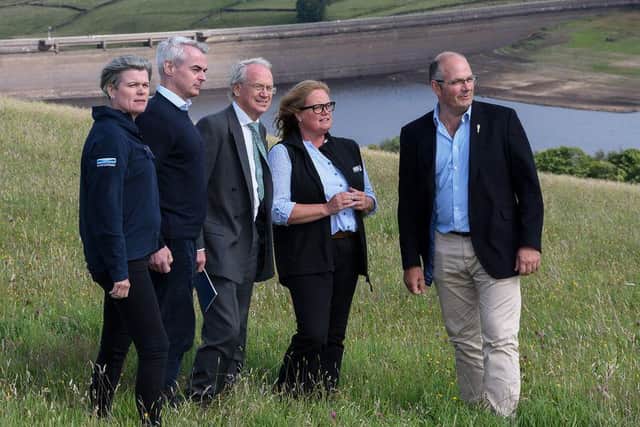 Nicola Shaw from Yorkshire Water, David Henderson, WaterUK CEO, Alan Lovell the Environment Agency Chief, Rachel Hallos, NFU Vice President. Tom Bradshaw NFU President with Baitings Reservoir in the background at the NFU Water Summit, 'Delivering clean water for food security' on NFU Vice President Rachel Hallos farm in Ripponden