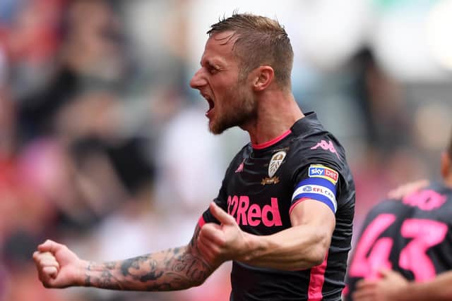 BRISTOL, ENGLAND - AUGUST 04: Liam Cooper of Leeds United celebrates Jack Harrison of Leeds United's goal during the Sky Bet Championship opener between Bristol City and Leeds United at Ashton Gate on August 04, 2019 in Bristol, England. (Photo by Alex Davidson/Getty Images)