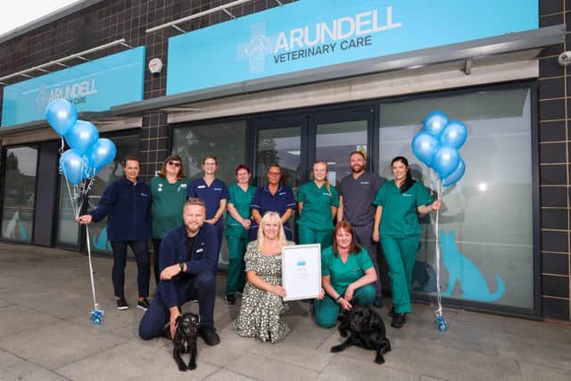 Practice manager Claire Coppin holding the RCVS Veterinary Hospital certificate with colleagues