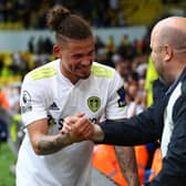 Kalvin Phillips of Leeds United greets a fan at Elland Road at the beginning of last season (Photo by Marc Atkins/Getty Images)