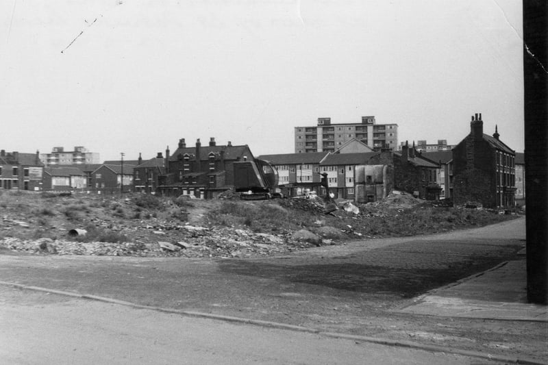 St. Mary's Lane, at the junction with Rider Street in May 1960. At the right edge part of the Parochial Hall can be seen, belonging to St. Patrick's Roman Catholic Church. Land is in the process of being cleared and was to become the site of Agnes Stewart C. of E. High School. In the background flats in Rigton Approach are visible.