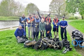 Volunteers from Novus Health with some of the haul from the first canal clean-up