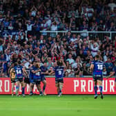 Wakefield Trinity fans celebrate Isaiah Vagana's try in the win against Castleford Tigers two weeks ago. Friday's visit of Leeds Rhinos is now sold out. Picture by Alex Whitehead/SWpix.com.