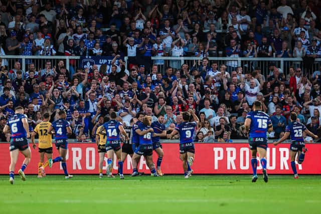 Wakefield Trinity fans celebrate Isaiah Vagana's try in the win against Castleford Tigers two weeks ago. Friday's visit of Leeds Rhinos is now sold out. Picture by Alex Whitehead/SWpix.com.