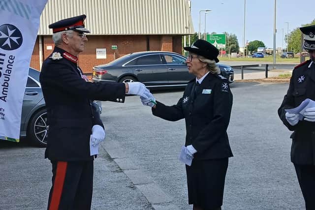 HM Lord-Lieutenant of The East Riding of Yorkshire, Jim Dick OBE, handing the keys to St John Ambulance County Commissionaire, Jacky Bowes