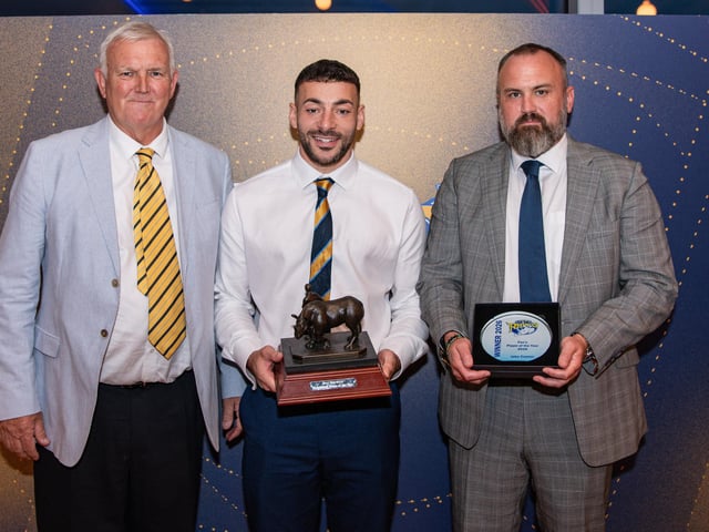 Roy Berwick supporters' player of the year Jake Connor with award sponsors Simon and John Walter.