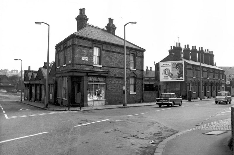 Woodhouse Street is on the left, on the horizon can be seen Sugar Well Hill and council flats which would be on Scott Hall Road. The right side of Woodhouse Street has properties which number 53-59. The shop at the corner with Cambridge Road is number 61, a drapers business. Cambridge Road is to the right and can be seen as far as Walter Grove. Pictured in August 1967.