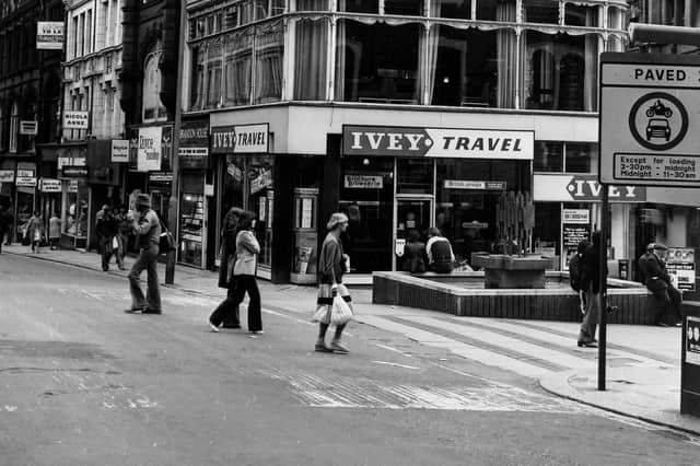 Lands Lane precinct at the corner with Albion Place in April 1979. The fountain and precinct were opened on April 12, 1972, by Environment Secretary Peter Walker. From the left, on Albion Place, shops include Bailey's, Nicola Anne, Willerby, Royce Manshop Ltd at number 27, Brandon House Ltd jeweller's at 28 and Ivey Travel at number 6 Lands Lane. A sign in the foreground informs that Lands Lane is a paved zone with vehicle restrictions.