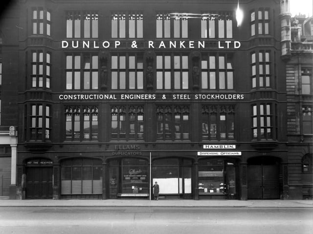 The south-west side of The Headrow showing Athenaeum House which was home to Dunlop and Ranken Ltd. engineers, Ellons Duplicator Co. Ltd., and T. Hamblin Ltd. opticians. Pictured in January 1950.