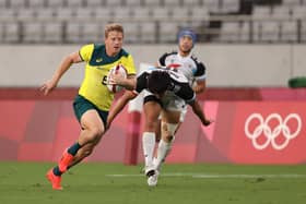 Lachie Miller makes a try-scoring break for Australia's rugby sevens side against South Korea on day three of the delayed Tokyo 2020 Olympic Games in Chofu, on July 26, 2021. Picture by Dan Mullan/Getty Images.