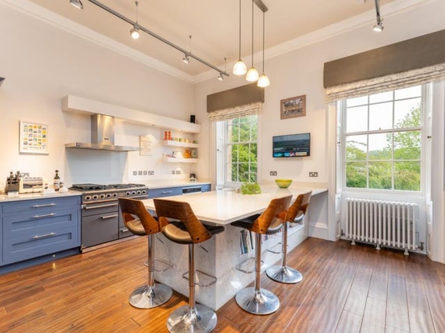 The breakfast kitchen is crafted with bespoke cabinetry.