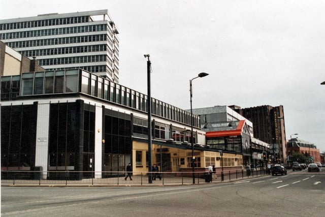 A side view of the Merrion Centre from the corner of Woodhouse Lane and Merrion Street. Ritzy's nightclub to left, in the distance is Fairfax House.