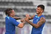 England's midfielder Kalvin Phillips (L) and England's defender Ben White take part in a  training session at the Al Wakrah SC Stadium in Al Wakrah, south of Doha, on November 20, 2022, on the eve of the Qatar 2022 World Cup football tournament Group B match between England and Iran. (Photo by Paul ELLIS / AFP) (Photo by PAUL ELLIS/AFP via Getty Images)