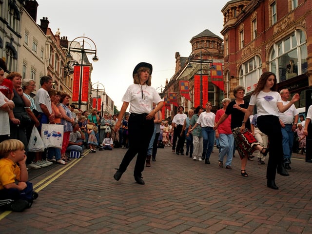 Karen Edmonds, centre, of the Edmonds Dance School leading the line dancers in the Briggate Line Dancing Bonanza in Briggate, Leeds,  as part of Rhythms of the City.