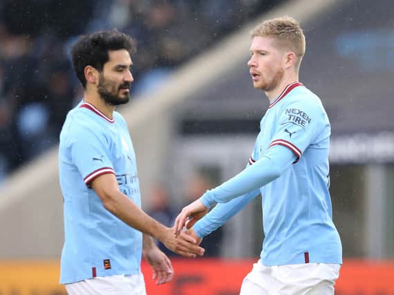 MANCHESTER, ENGLAND - DECEMBER 17: Kevin De Bruyne of Manchester City celebrates after scoring their side's first goal with Ilkay Gundogan during the friendly match between Manchester City and Girona at Manchester City Academy Stadium on December 17, 2022 in Manchester, England. (Photo by Jan Kruger/Getty Images)