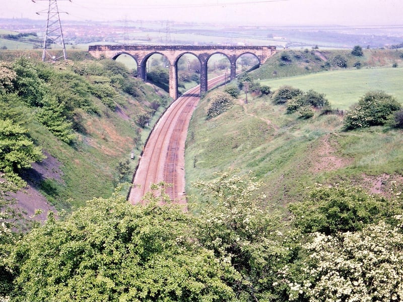 Dunningley Viaduct as seen from Thorpe Lane (A654) in May 1967 . The Viaduct crossed the Leeds to Wakefield line and connected Woodkirk to Beeston.