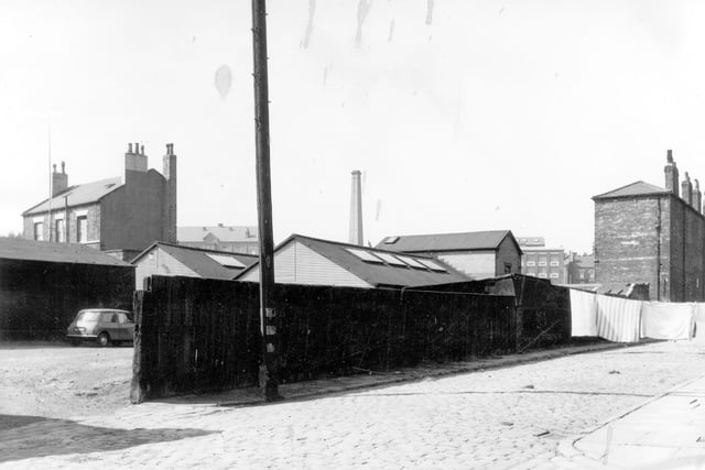 The Vicar Street entrance to the Tower Table Water Co. Ltd on the left and on the right is a washing line laden down with sheets. Pictured in August 1964.