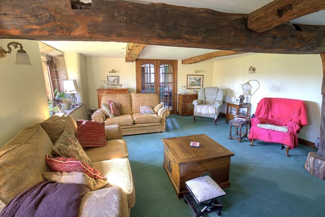 The rustic and roomy lounge within the cottage.