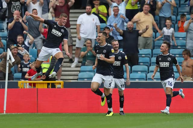 FLYING START: Millwall's Leeds United loanee Charlie Cresswell, left, jumps for joy after netting for the second time against Stoke City as Whites team mate Jamie Shackleton, right, shows his delight. Photo by Henry Browne/Getty Images.