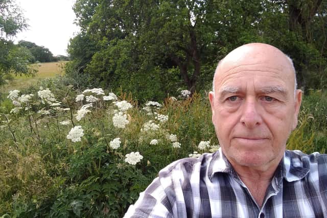 Michael Lowry said that he was worried about children or animals being burnt by the plants, pictured behind him in Cookridge, Leeds.