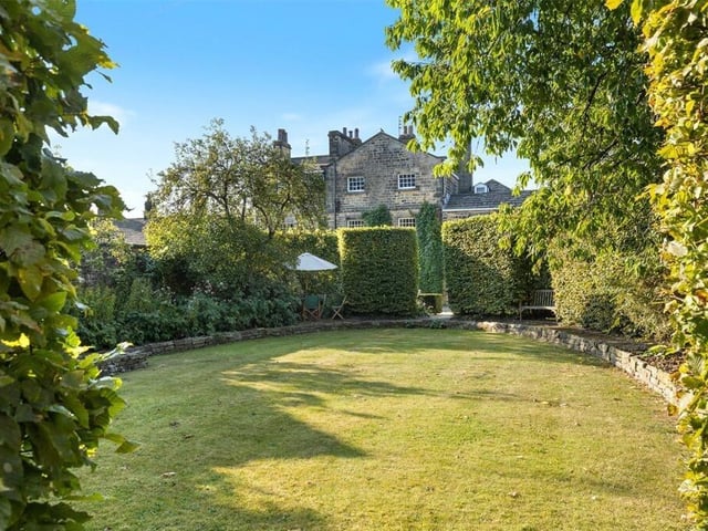 At the back of the property, a private gated driveway provides parking for numerous cars, access to the double garage and a fully enclosed and private walled garden, with established trees and planting.