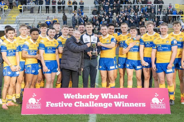 Leeds Rhinos receive the Wetherby Whaler Festive Challenge trophy following last year's win against Wakefield Trinity. Picture by Tony Johnson.