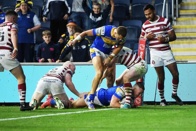 Harry Newman scores for Rhinos against Wigan last season. Picture by Jonathan Gawthorpe.